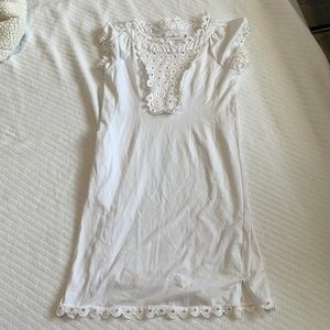 White dress with pattern work.